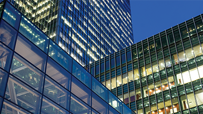 Street view looking up at a building at night
