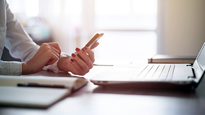 Woman's hands holding a smartphone
